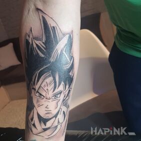 Tattoo Son Goku on the forearm motif: manga / anime style: cartoon / comic book