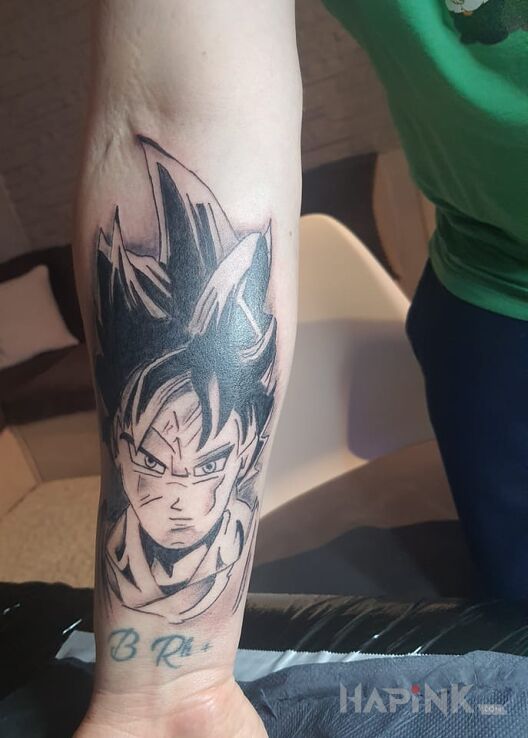 Tattoo Son Goku in characters motif and cartoon / comic book style on the forearm