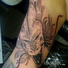 Tattoo Shen Long On the arm motif: manga / anime style: cartoon / comic book