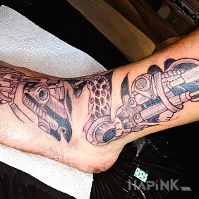 Tattoo Biomechanics on the foot motif: black and gray style: biomechanics