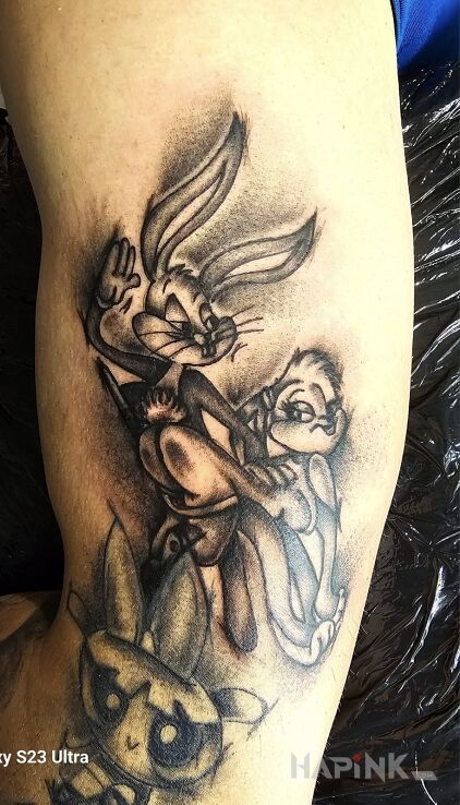 Tattoo Baks i Lola in characters motif and cartoon / comic book style On the arm