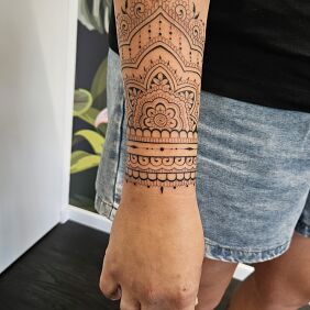 Tattoo Ornament meaning on the forearm On the arm motif: black and gray style: contour / linework