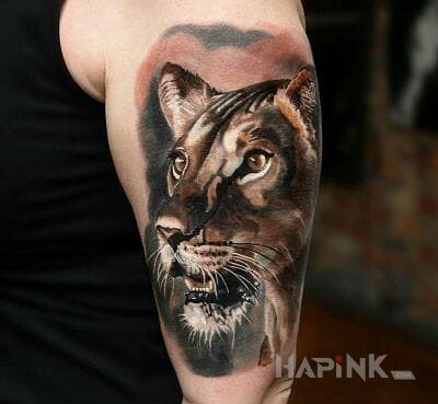 Tattoo Lwica in animals motif and realistic style on the upper arm
