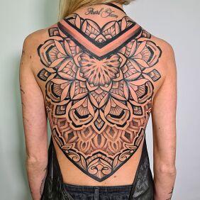 Tattoo Back mandala on the back motif: black and gray style: geometric