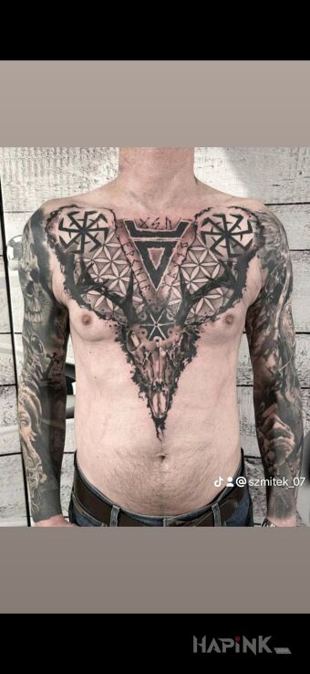 Tattoo Słowiańskie klimaty in skulls motif and graphic / illustrative style on the upper arm