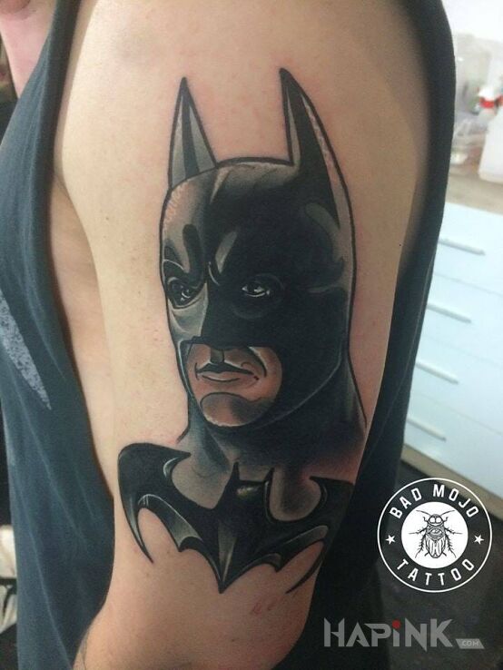 Tattoo Baaatmaaan! in faces motif on the forearm