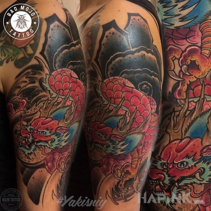 Tattoo Smoki in dragons motif and japanese / irezumi style on the upper arm