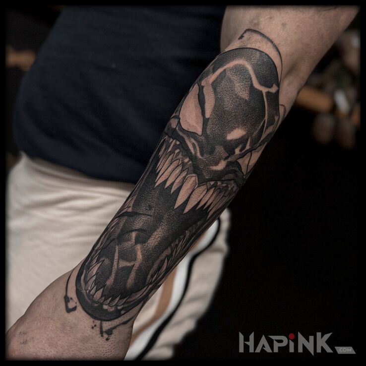 Tattoo Venom in characters motif and dotwork style On the arm