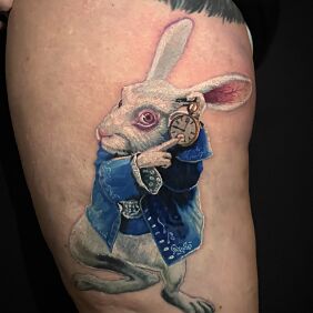 Tattoo White rabbit from Alice in Wonderland on the thigh motif: colorful style: realistic