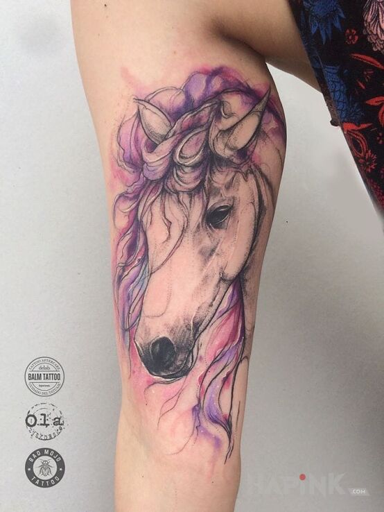 Tattoo Konik in animals motif on the calf