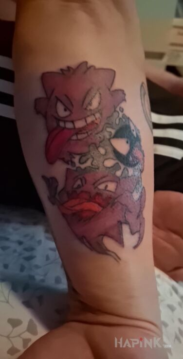 Tattoo Gengar pokemon in characters motif and graphic / illustrative style on the forearm