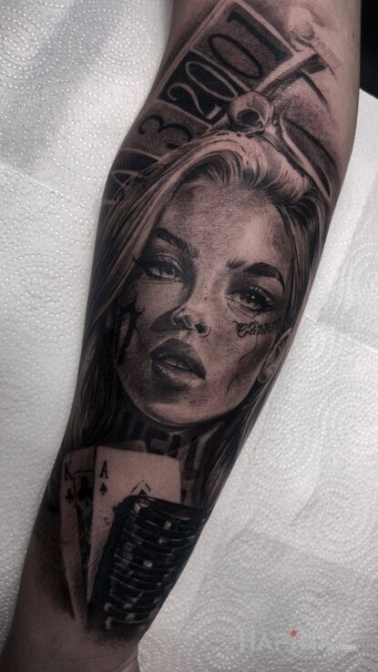 Tattoo BLACK BONITA in faces motif and realistic style On the arm