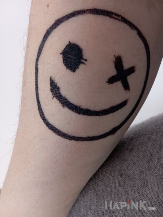 Tattoo Emotka in other motif and graphic / illustrative style on the forearm