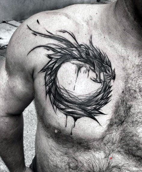 Tattoo Uroboros in characters motif on the chest