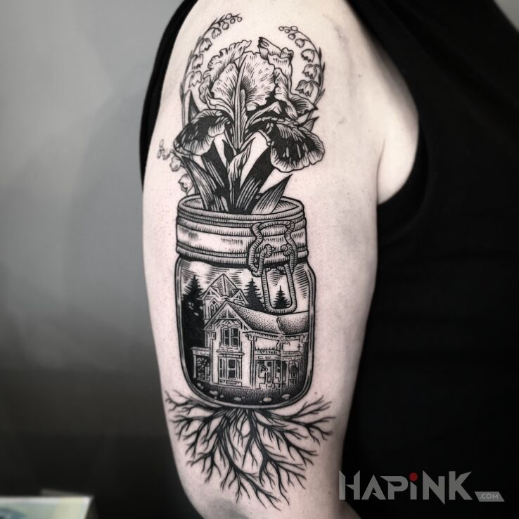 Tattoo Kwiaty w słoiku in black and gray motif and engravings / gravure style on the upper arm