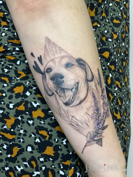 Tattoo Szczęśliwy piesek in animals motif and realistic style On the arm