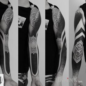 Tattoo Deep black paired with geometry on the upper arm motif: mandalas style: blackwork / blackout