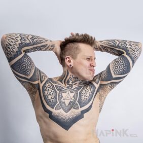 Tattoo Client with a large geometric composition on the forearm motif: ornaments style: dotwork