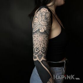 Tattoo Feminine composition with black insert On the arm motif: sleeves style: geometric