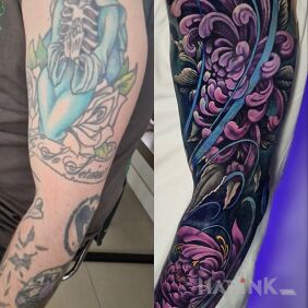 Tattoo Cover-up of an old tattoo on the upper arm motif: floral style: realistic