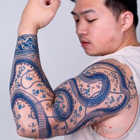 Tattoo The Power of the Blue Dragon on the upper arm motif: sleeves style: graphic / illustrative