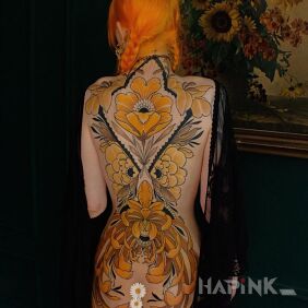 Tattoo Flowers in shades of yellow on the nape motif: colorful style: neo-traditional