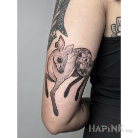 Tattoo Beautiful deer in dotwork on the upper arm motif: flowers style: graphic / illustrative
