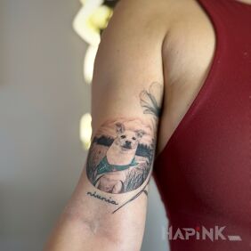 Tattoo Tattoo of a beloved dog on the arm on the bicep motif: floral style: dotwork