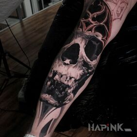 Tattoo Skull on the tibia motif: black and gray style: realistic