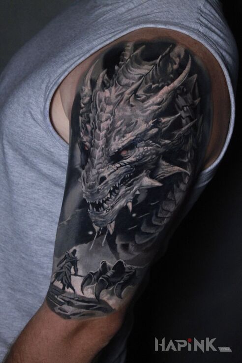 Tattoo Smok in fantasy motif and realistic style On the arm