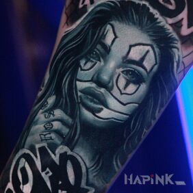 Tattoo Chicano girl on the forearm motif: black and gray style: chicano