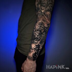 Tattoo Tiger Over the Pagoda on the forearm motif: animals style: realistic