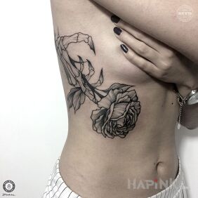 Tattoo Alexandra's work with Bad Mojo Tattoo Gdansk. on the ribs motif: flowers