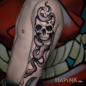 Tattoo Skull with a snake on the upper arm motif: black and gray style: realistic