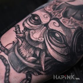 Tattoo Japanese mask on the bicep motif: fantasy style: japanese / irezumi