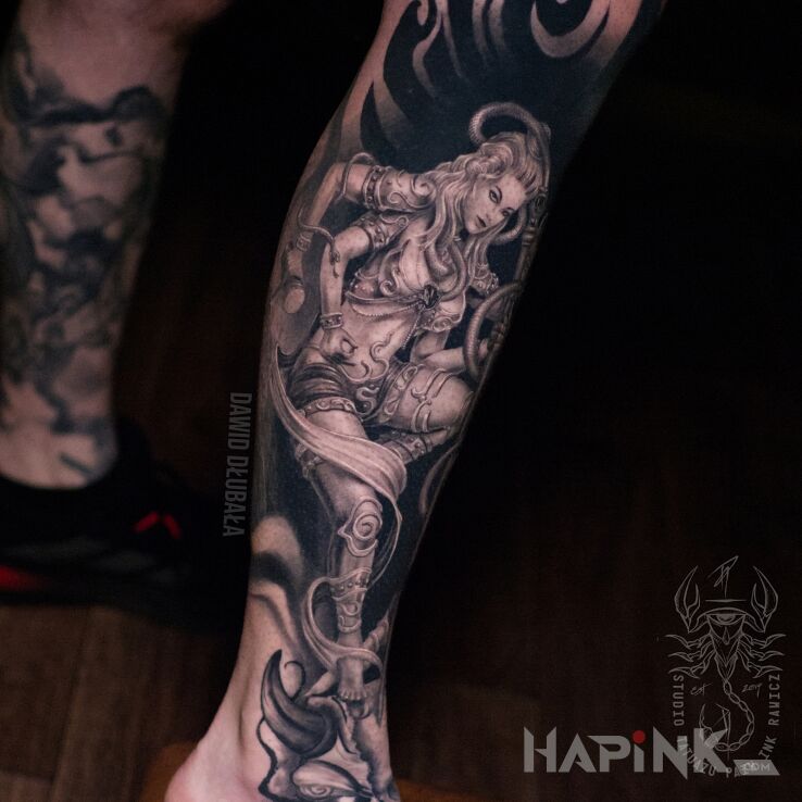 Tattoo Noga Shiva in characters motif and realistic style on the tibia