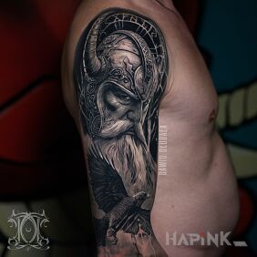 Tattoo Viking on the upper arm motif: faces style: realistic
