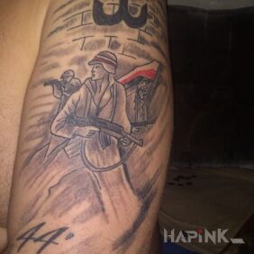 Tattoo L on the upper arm motif: war