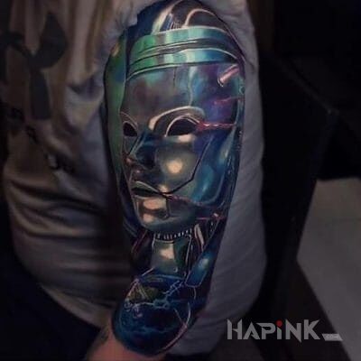 Tattoo Metalowa maska in faces motif on the upper arm