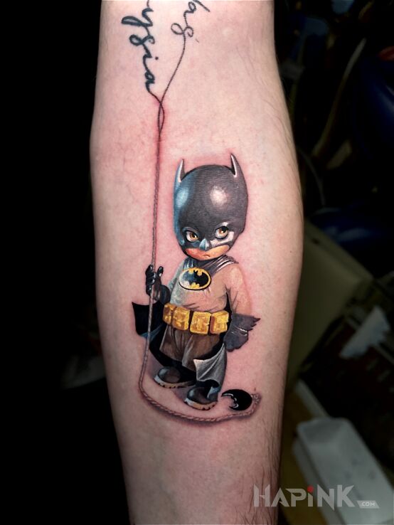 Tattoo Młody batman in małe motif and realistic style On the arm