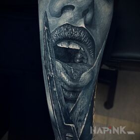 Tattoo Tongue in scissors On the arm motif: black and gray style: realistic