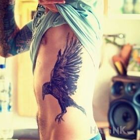Tattoo Raven on the ribs motif: animals style: realistic