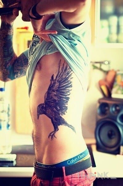 Tattoo Kruk in animals motif and realistic style on the ribs