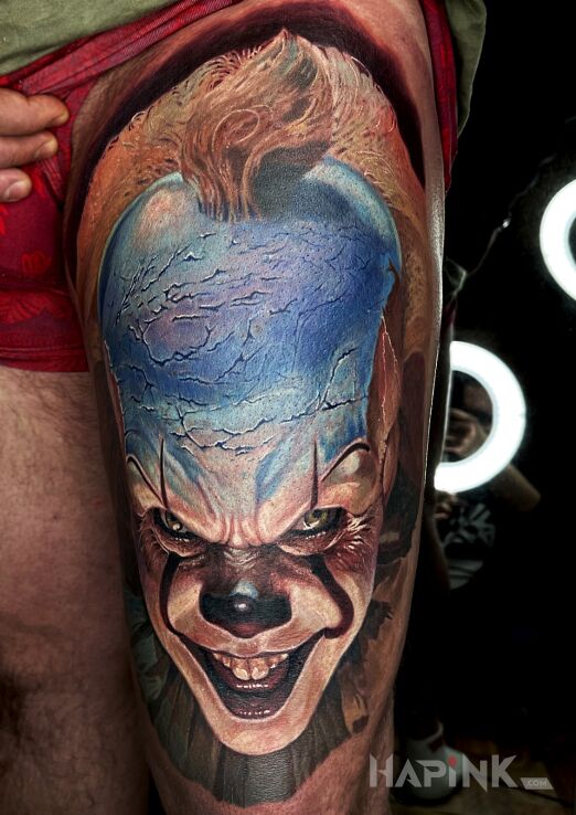 Tattoo Pennywise in characters motif and realistic style on the leg