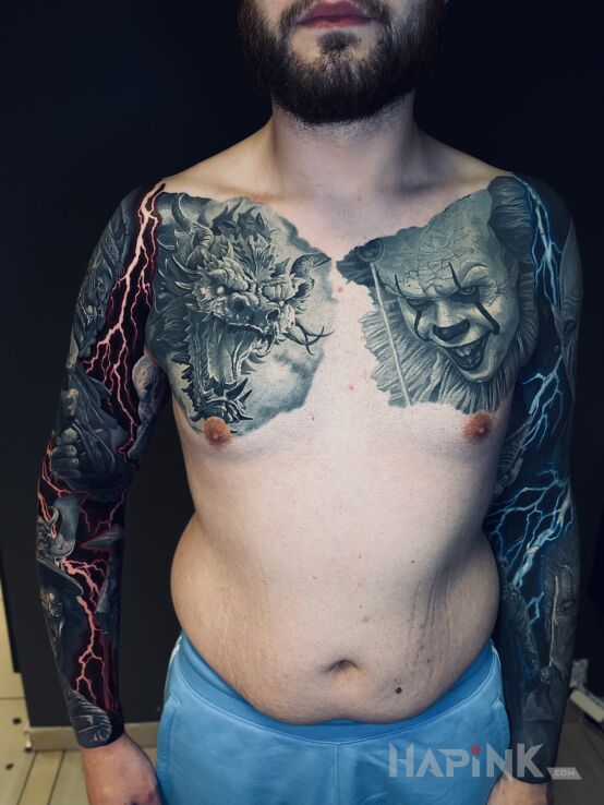 Tattoo Smok in sleeves motif and realistic style on the upper arm