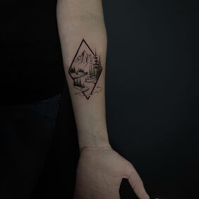 Tattoo Mountains with forest in miniature On the arm motif: nature style: graphic / illustrative