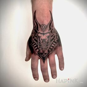Tattoo Anubis On the arm motif: black and gray style: graphic / illustrative