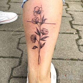 Tattoo Flowers growing along the cross on the leg motif: religious style: contour / linework