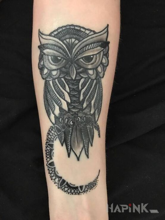 Tattoo Sowa in animals motif on the forearm