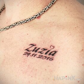 Tattoo Name and date of daughter on the chest motif: Love style: calligraphy